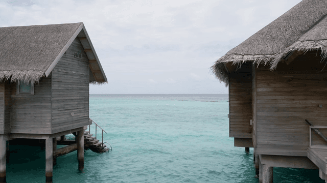 Overwater bungalows by the turquoise sea