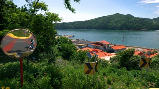 Coastal Village beyond the Lush Green Hills