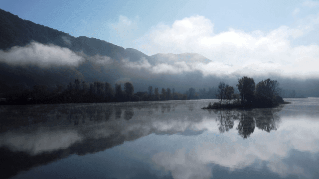 Misty mountains and tranquil lake