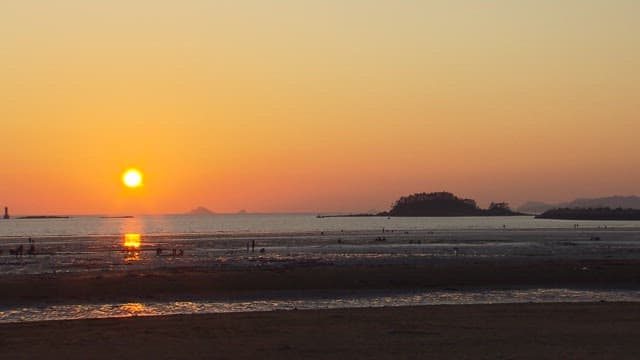 Serene Sunset at the Low Tide Beach