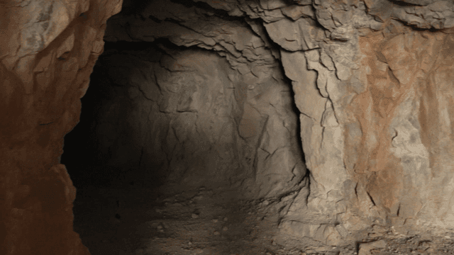 Inside a dimly lit rocky cave
