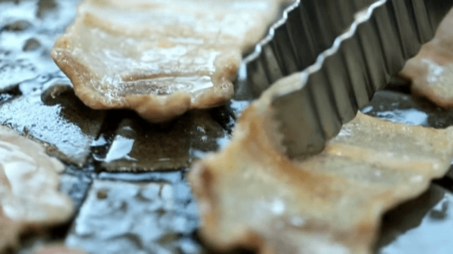 Sizzling Grilled Pork Belly on a hot grill