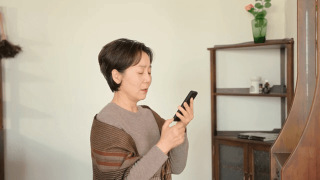 Woman talking on the phone indoors