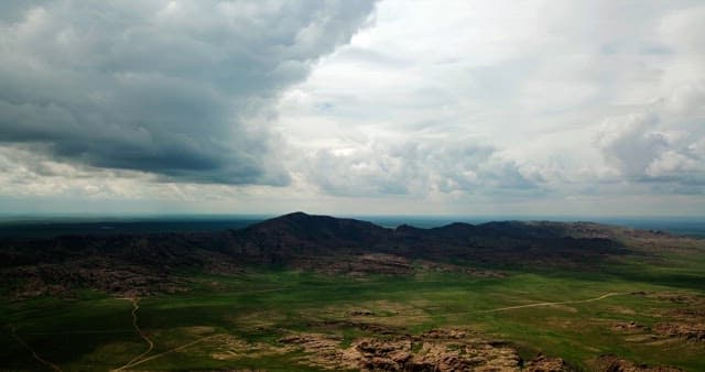 Vast landscape with mountains and clouds