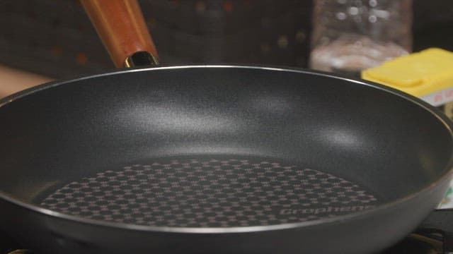 Chopped smoked duck in a heated frying pan