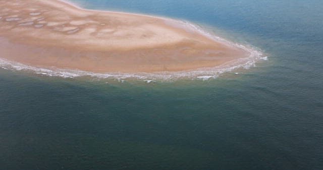 Sandbank Exposed in the Middle of the Sea