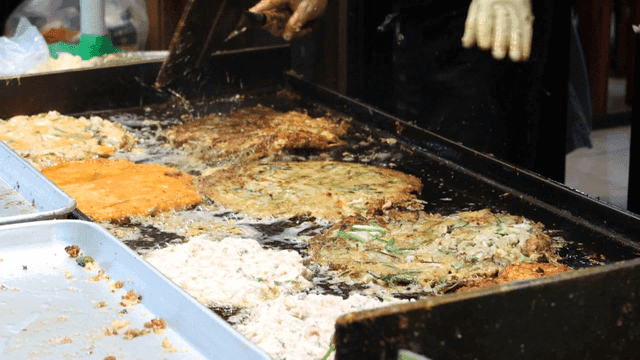 Griddle filled with frying pancakes