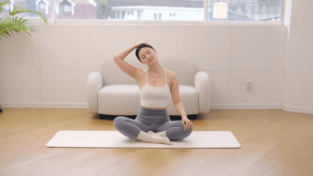 Woman stretching indoors