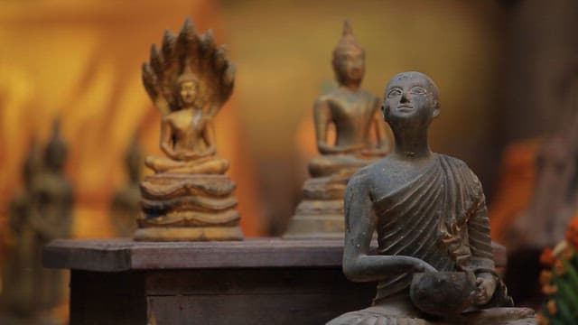 Buddha statues in a serene temple setting