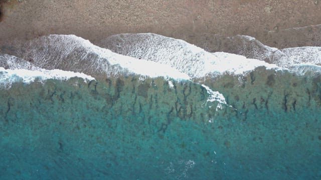 Waves crashing on a sandy beach