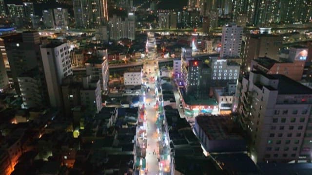 Night View of the City with Brightly Lit Streets and Buildings