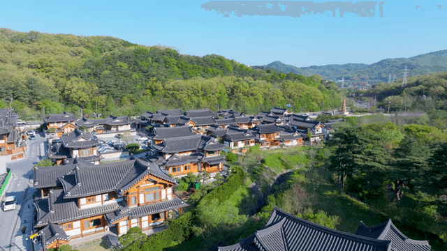 Hanok village situated below mountain ridge