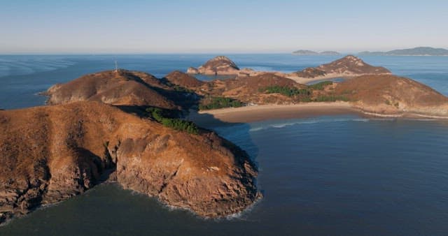 Serene Coastal Landscape with Hills and Sea