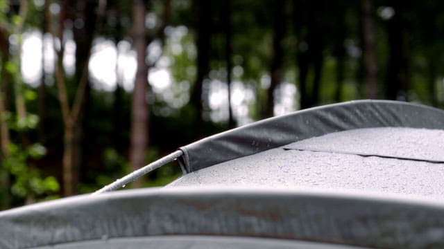 Raindrops on a tent in a forest