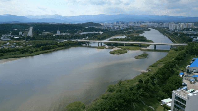 Quiet river flowing under bridge