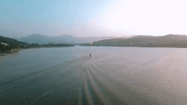 Boat sailing on calm lake