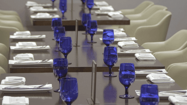 Elegant table setting with blue wine glasses