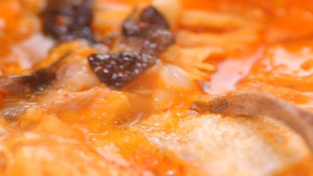 Codfish soup boiling in a pot