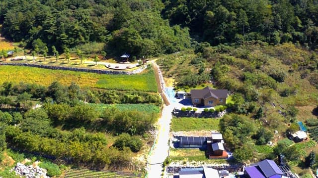 Scenic rural area with a house amidst greenery