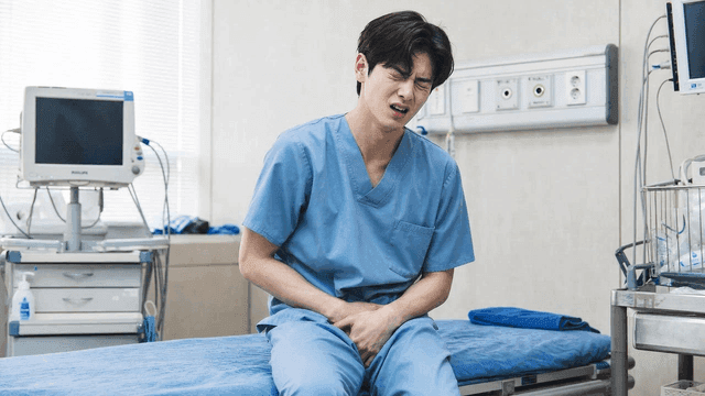 Young male patient who is uncomfortable in hospital bed