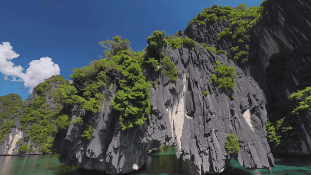 Tropical rocky island in clear blue sea