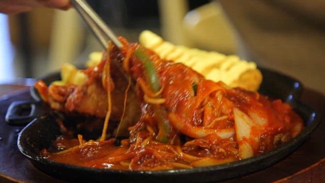 Crispy cheese pork cutlet with spicy sauce with bean sprouts