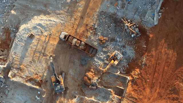 Construction site with machinery and truck