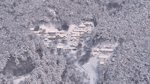 Snow-covered traditional Korean village