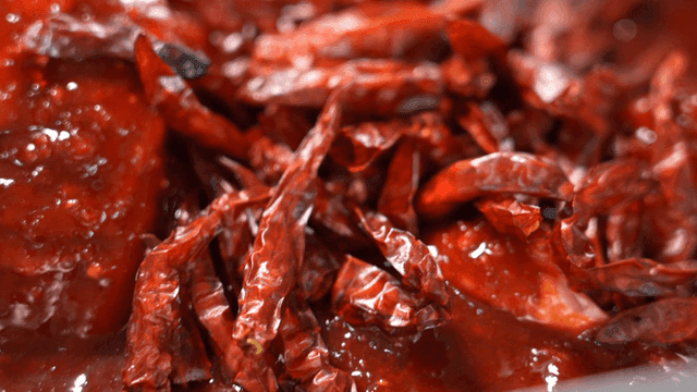 Red chili peppers in spicy gochujang sauce