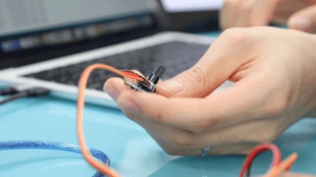 Hands assembling electronic components