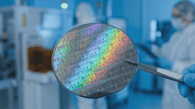 Semiconductor silicon wafer lifted with tongs