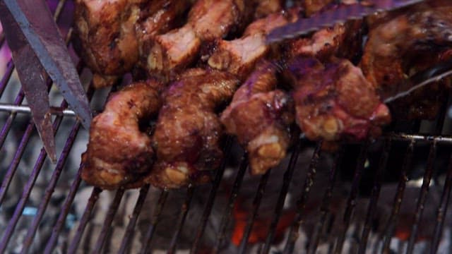 Sizzling grilled pork galbi on the grill