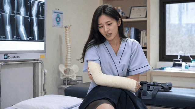 Woman with cast on her arm at clinic