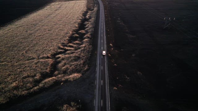 Car driving on a long road