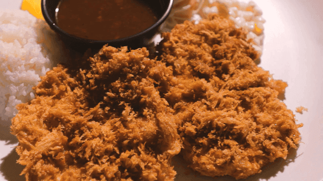 Crispy pork cutlet with rice and salad