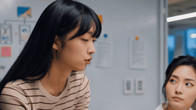 Two women discussing in an office