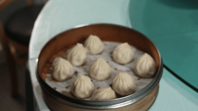 Steamed dumplings in a bamboo steamer