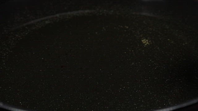 Bread frying in hot oil in a pan