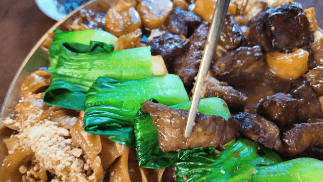 Chopsticks for picking up beef and bok choy