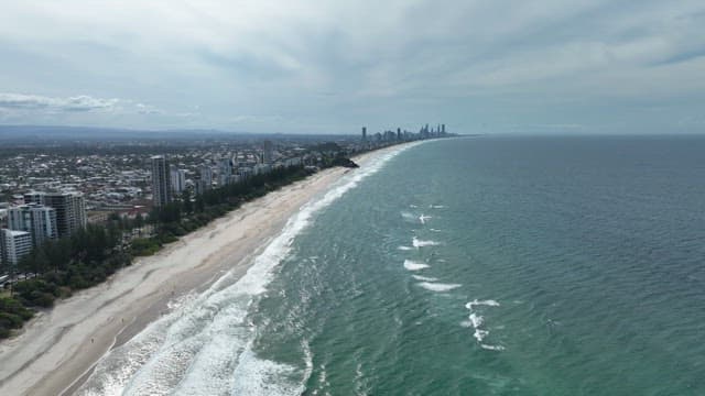 Aerial View of Coastal Cityscape and Beach