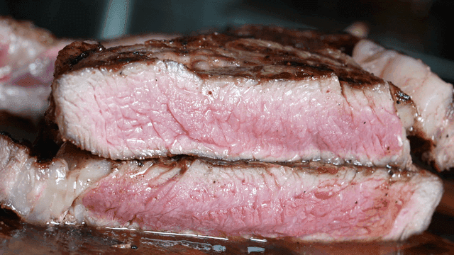 Juicy cut of steak on cutting board