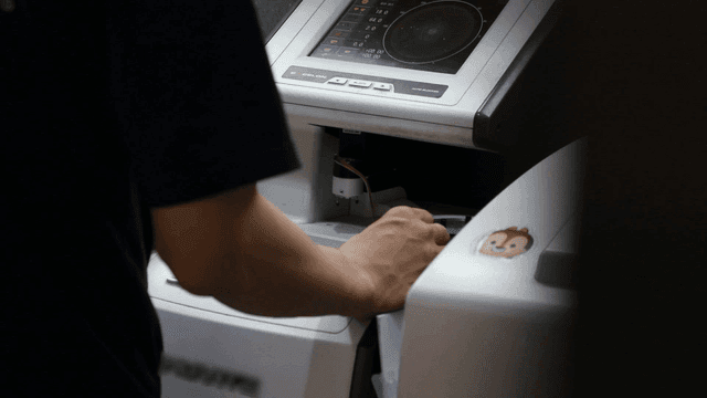Person operating a machine indoors
