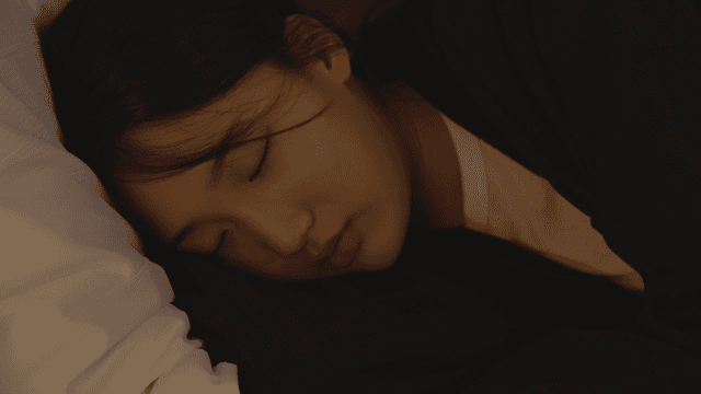 Woman resting her head on a pillow