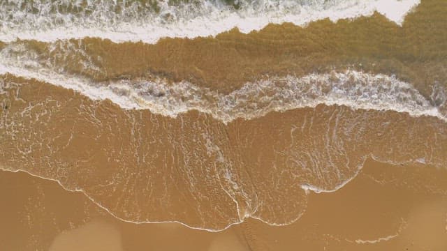 Gentle Waves on a Sandy Beach