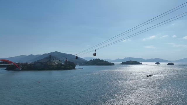 Cable cars over a scenic coastal