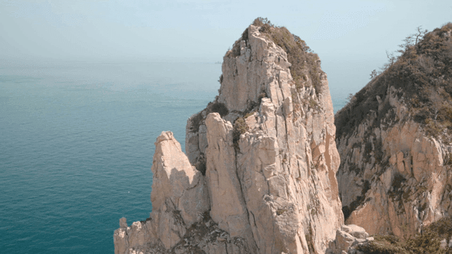 Rocky cliff by the calm sea