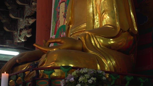 Magnificent golden Buddha statue in a quiet temple