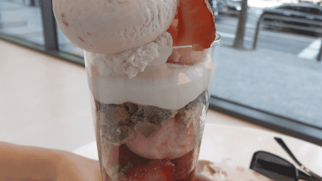 Strawberry parfait topped with ice cream