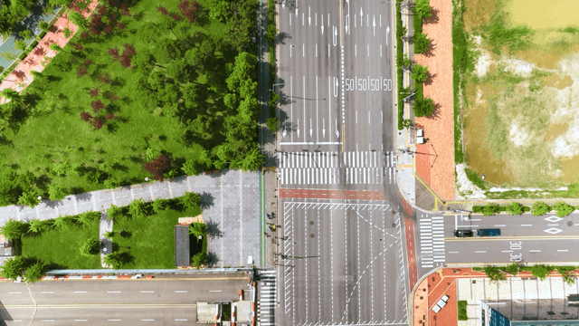 Aerial view of a city road and park