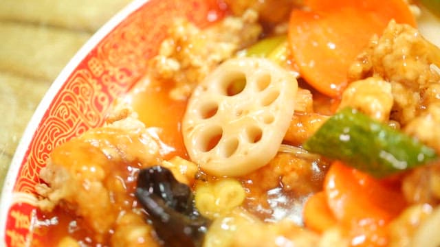 Crispy and delicious sweet and sour pork with lotus root